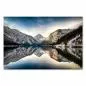 Preview: Ein kristallklarer See in den Alpen spiegelt die schneebedeckte Winterlandschaft – ein Bild von Ruhe und Schönheit. Preview: Ein kristallklarer See in den Alpen spiegelt die schneebedeckte Winterlandschaft – ein Bild von Ruhe und Schönheit.