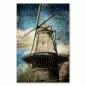 Preview: Eine alte Windmühle vor blauem Himmel und Wolken. Preview: Eine alte Windmühle vor blauem Himmel und Wolken.