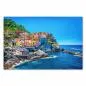 Preview: Farbenfrohe Häuser schmiegen sich an die Klippen der Cinque Terre, das türkisblaue Ligurische Meer glitzert in der Sonne. Preview: Farbenfrohe Häuser schmiegen sich an die Klippen der Cinque Terre, das türkisblaue Ligurische Meer glitzert in der Sonne.