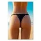 Preview: Junge Frau in schwarzer Bikinihose am Strand, leicht mit Wasser benetzt. Preview: Junge Frau in schwarzer Bikinihose am Strand, leicht mit Wasser benetzt.
