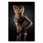 Preview: Trainierte Frau mit Sixpack im Fitnessstudio, Sportbekleidung, konzentrierter Blick. Preview: Trainierte Frau mit Sixpack im Fitnessstudio, Sportbekleidung, konzentrierter Blick.