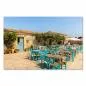 Preview: Einladendes Restaurant mit blauen Tischen unter freiem Himmel, rustikale Steinmauer schafft gemütliche Atmosphäre. Preview: Einladendes Restaurant mit blauen Tischen unter freiem Himmel, rustikale Steinmauer schafft gemütliche Atmosphäre.