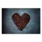 Preview: Herz aus Kaffeebohnen auf blauem Hintergrund - Symbol für die Liebe zum Kaffee. Preview: Herz aus Kaffeebohnen auf blauem Hintergrund - Symbol für die Liebe zum Kaffee.