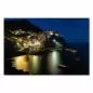 Preview: Malerische Häuser von Manarola in der Nacht spiegeln sich im Mittelmeer: ein Anblick wie aus dem Bilderbuch. Preview: Malerische Häuser von Manarola in der Nacht spiegeln sich im Mittelmeer: ein Anblick wie aus dem Bilderbuch.