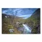 Preview: Rauschender Wasserfall zum Fjord, Blick auf umliegende Berge öffnet sich im Hintergrund. Preview: Rauschender Wasserfall zum Fjord, Blick auf umliegende Berge öffnet sich im Hintergrund.