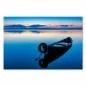 Preview: Boot auf spiegelglattem See, Sonnenaufgang taucht Himmel in warme Farben, friedliche Stimmung. Preview: Boot auf spiegelglattem See, Sonnenaufgang taucht Himmel in warme Farben, friedliche Stimmung.