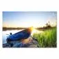 Preview: Blaues Boot am Seeufer, Sonnenuntergang taucht Umgebung in goldenes Licht. Preview: Blaues Boot am Seeufer, Sonnenuntergang taucht Umgebung in goldenes Licht.