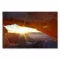 Preview: Die aufgehende Sonne taucht einen weiten Canyon in goldenes Licht, Blick durch einen natürlichen Felsbogen. Preview: Die aufgehende Sonne taucht einen weiten Canyon in goldenes Licht, Blick durch einen natürlichen Felsbogen.