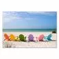 Preview: Sechs bunte Strandkörbe am weißen Sandstrand laden zum Verweilen ein, das Meer glänzt im Hintergrund. Preview: Sechs bunte Strandkörbe am weißen Sandstrand laden zum Verweilen ein, das Meer glänzt im Hintergrund.