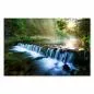 Preview: Sonnenstrahlen erhellen einen kleinen Wasserfall im Wald - ein idyllisches Bild voller Ruhe. Preview: Sonnenstrahlen erhellen einen kleinen Wasserfall im Wald - ein idyllisches Bild voller Ruhe.