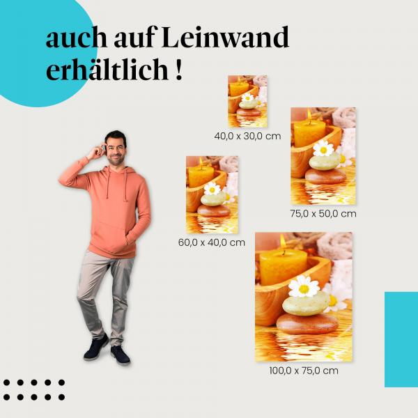 Wellness: Leinwandbild. Massagesteine, Kerze, Blüten, Handtücher.