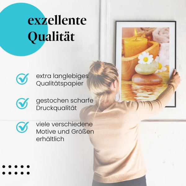 Gerahmtes Bild "Wellness & Entspannung" - Massagesteine & Kerze, Wohlfühlatmosphäre.